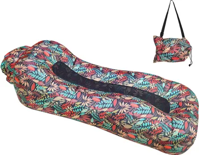 An inflatable lounger and its storage bag are displayed against a white background.