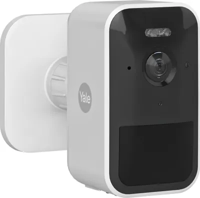 A Yale smart home outdoor camera mounted on a white bracket.