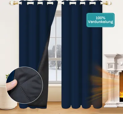 A pair of navy blue blackout curtains are shown hanging in front of a window, with a close-up inset showing the quilted lining of one curtain. A fireplace is visible to the right.