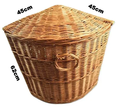 A wicker corner laundry basket with dimensions indicated.