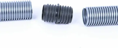 A close-up studio shot of a vacuum cleaner hose repair kit on a white background.