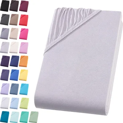 A collection of fabric swatches in various colors arranged in columns on the left, and a close-up view of a light gray fitted sheet on the right.