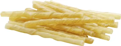 A pile of twisted rawhide dog chews on a white background.