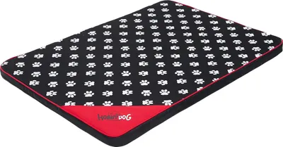 A dog bed with a paw print pattern.