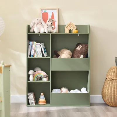 A green children's bookshelf filled with toys and books, placed in a room with a light-colored wall and wooden floor.