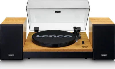 A turntable with two speakers, presented in a studio setting against a white background.