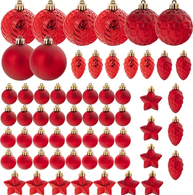 A collection of red Christmas ornaments arranged in rows.