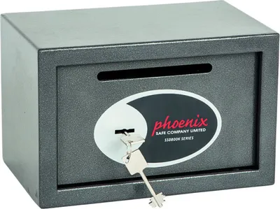 A small, gray, metal safe with a key lock and a slot for deposits.