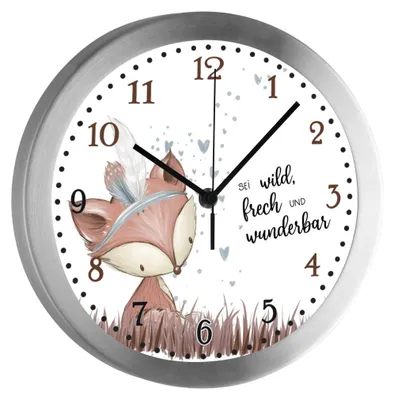 A close-up of a children's wall clock featuring a cartoon fox illustration and German text.