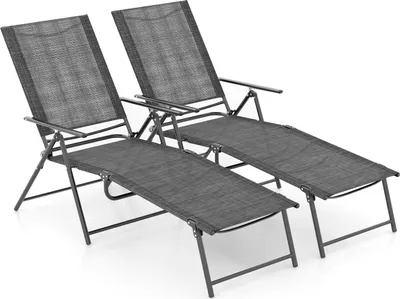 Two grey folding lounge chairs are shown on a white background.