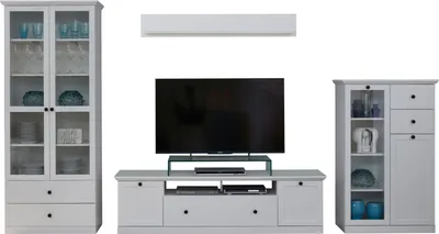 A white living room furniture set including a tall display cabinet, a TV stand with a television, and a smaller cabinet.