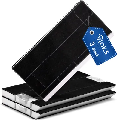 A stack of three black carbon filters for a cooker hood, with a blue tag attached to the top filter.