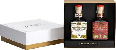 A gift set of two bottles of balsamic vinegar in a presentation box.