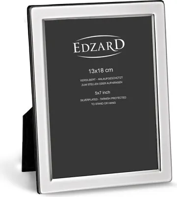 A silver picture frame with text on the black insert.