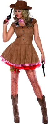 A woman dressed in a cowgirl costume, holding toy guns.