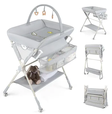 Image de Table à langer pliable COSTWAY avec arceau de jeu, commode à langer à 3 tiroirs, ensemble à langer avec matelas à langer, sac de rangement et roulettes, table à langer