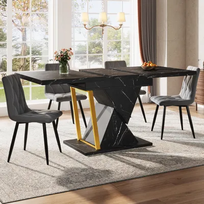 A dining room with a marble-look extendable table and chairs.