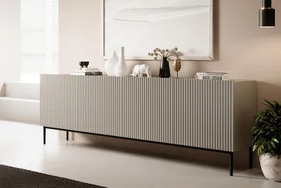 A modern living room with a long, ribbed sideboard.
