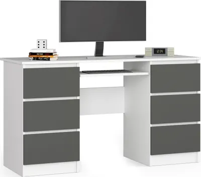 A modern white and dark gray desk with a computer monitor, keyboard, and drawers.