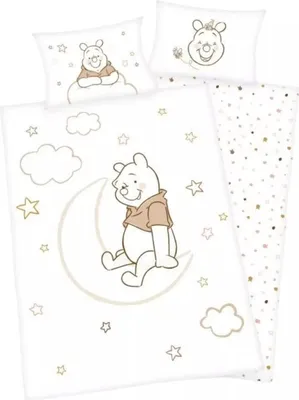 A Winnie the Pooh themed duvet cover and pillowcase set with stars and clouds.
