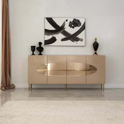 A modern living room with a beige sideboard, abstract art, and decorative items.