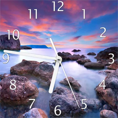 Produktbild von Wallario Design Wanduhr Seelandschaft in blau und rot mit großen Felsen aus Echtglas, Größe 20 x 20 cm