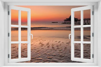 Produktbild von Wallario Poster mit Fenster-Illusion: Strand am Abend - Seebrücke am Ostseebad Heringsdorf, Größe: 100 x 150 cm