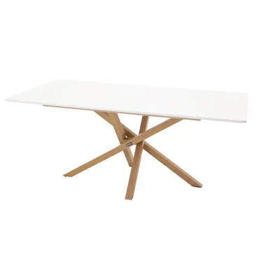 A white rectangular dining table with a wooden base.