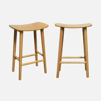 Two wooden bar stools are shown against a white background.