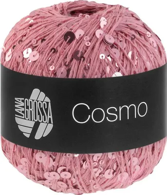 A ball of pink yarn with sequins, with a black label.