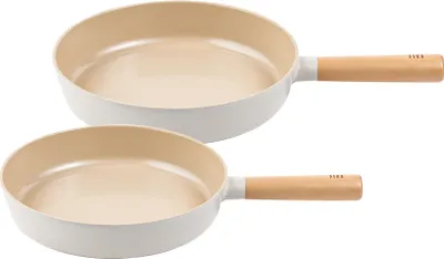 Two frying pans are shown stacked on a white background.