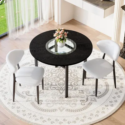 Productafbeelding van STILVORA Eettafelset, rond, met 4 stoelen van Polyurethanmateriaal en comfortabele rugleuning. Ronde tafel, diameter 100 cm, met een zwarte houtlook. Eetset voor de woonkamer, zwart en wit