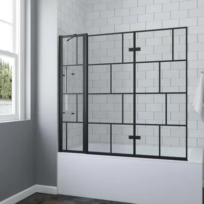 A shower screen for a bathtub in a bathroom.