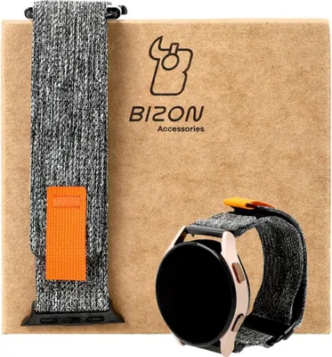 A watch band and a smartwatch are displayed on a cardboard box.
