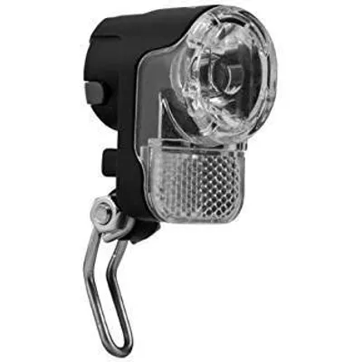 A close-up studio shot of a black and clear bicycle headlight.