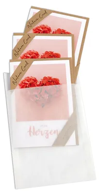 A stack of greeting cards with floral imagery, partially enclosed in a translucent sleeve.