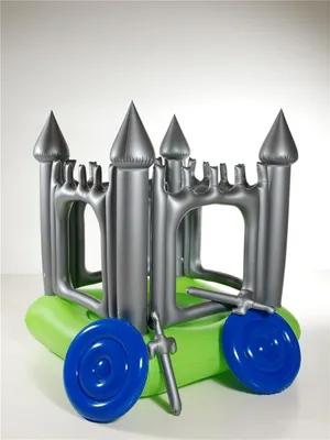 An inflatable castle with accessories on a white background.