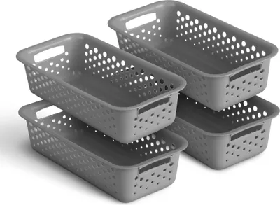 Four gray storage baskets are stacked and arranged in a way that shows their shape and perforated design.