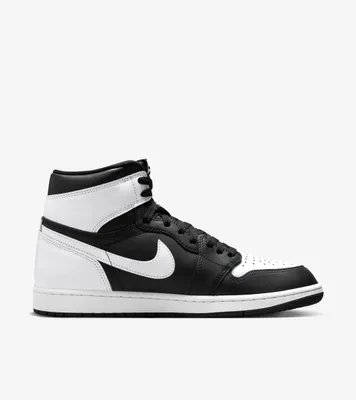 A studio shot of a single Nike Air Jordan 1 Mid Retro sneaker.