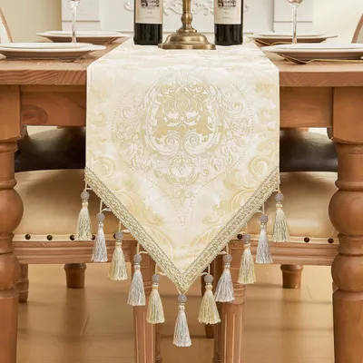 Immagine prodotto di Runner da tavolo con frange, 33x180 cm, color oro chiaro