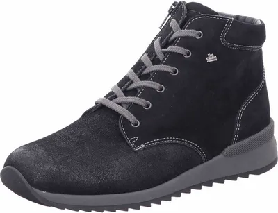 A black women's boot on a white background.