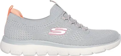 A side view of a gray Skechers shoe with pink accents.