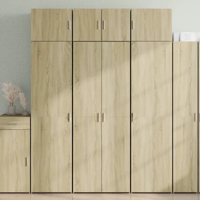 A set of wooden cabinets with a light wood finish against a light gray textured background.