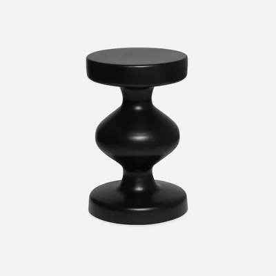 A black metal side table with a unique hourglass shape is presented against a light gray background.