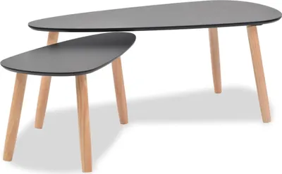 Two nesting coffee tables with black tops and wooden legs, shown against a white background.
