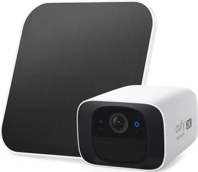 A white security camera and its solar panel are shown against a white background.