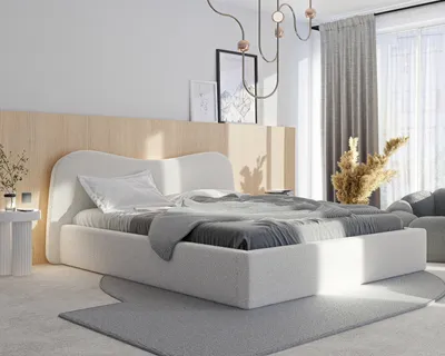 A bedroom scene with a bed, nightstand, and decor.