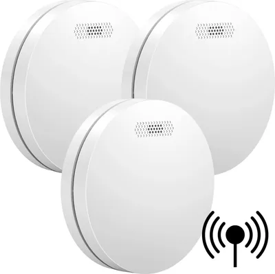Three white, circular smoke detectors are arranged in a cluster against a white background. A black icon representing wireless connectivity is visible in the bottom right corner.