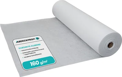 A roll of white protective covering material, partially unrolled to show its texture and a label with product information.
