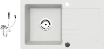 A white granite kitchen sink with a drainboard and a separate siphon set.